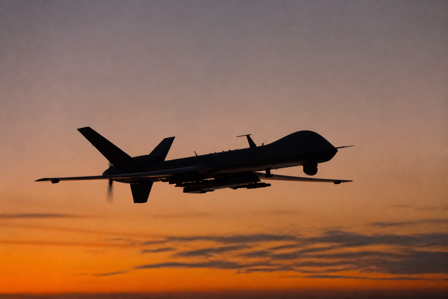 Unmanned aerial vehicle silhouetted against the sky